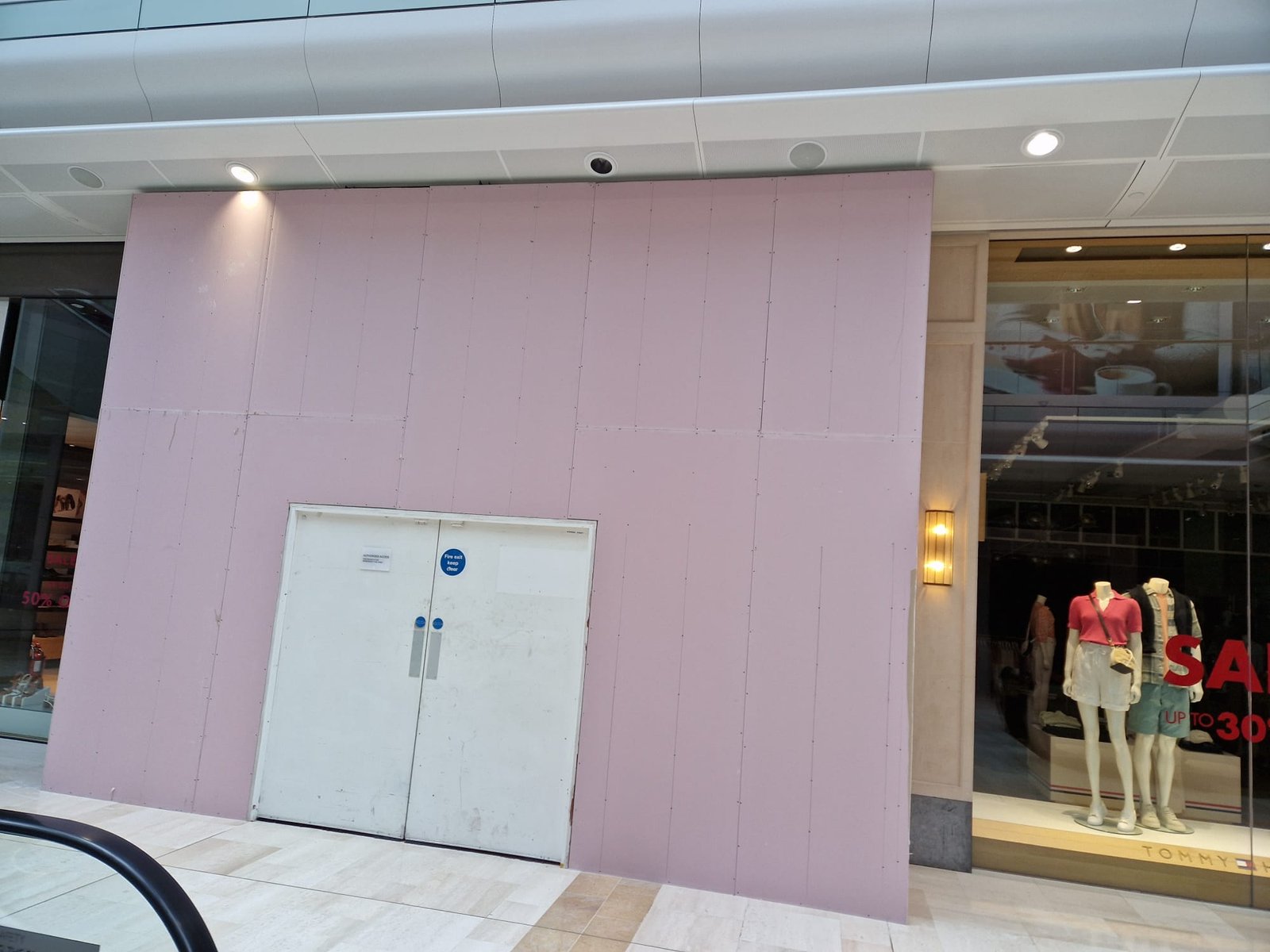 Hoarding face with fire exit access maintained