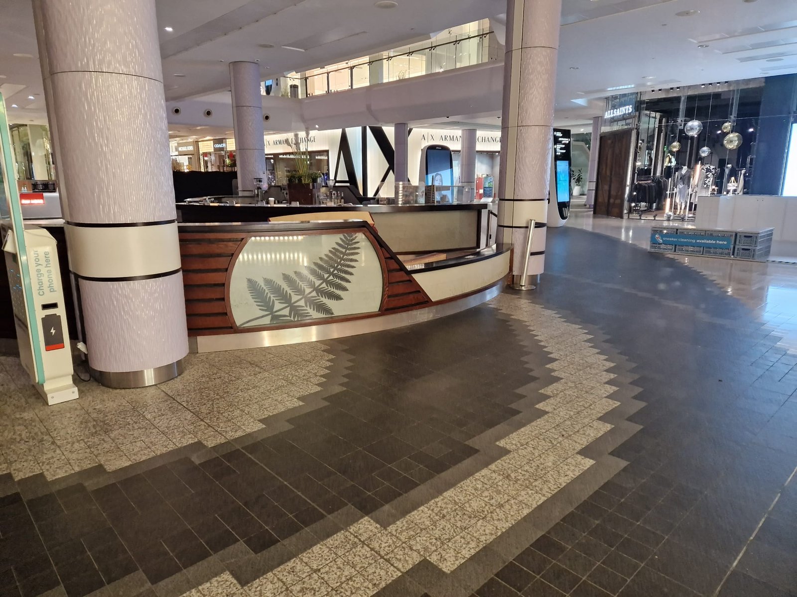 Coffee kiosk with fern panel awaiting removal