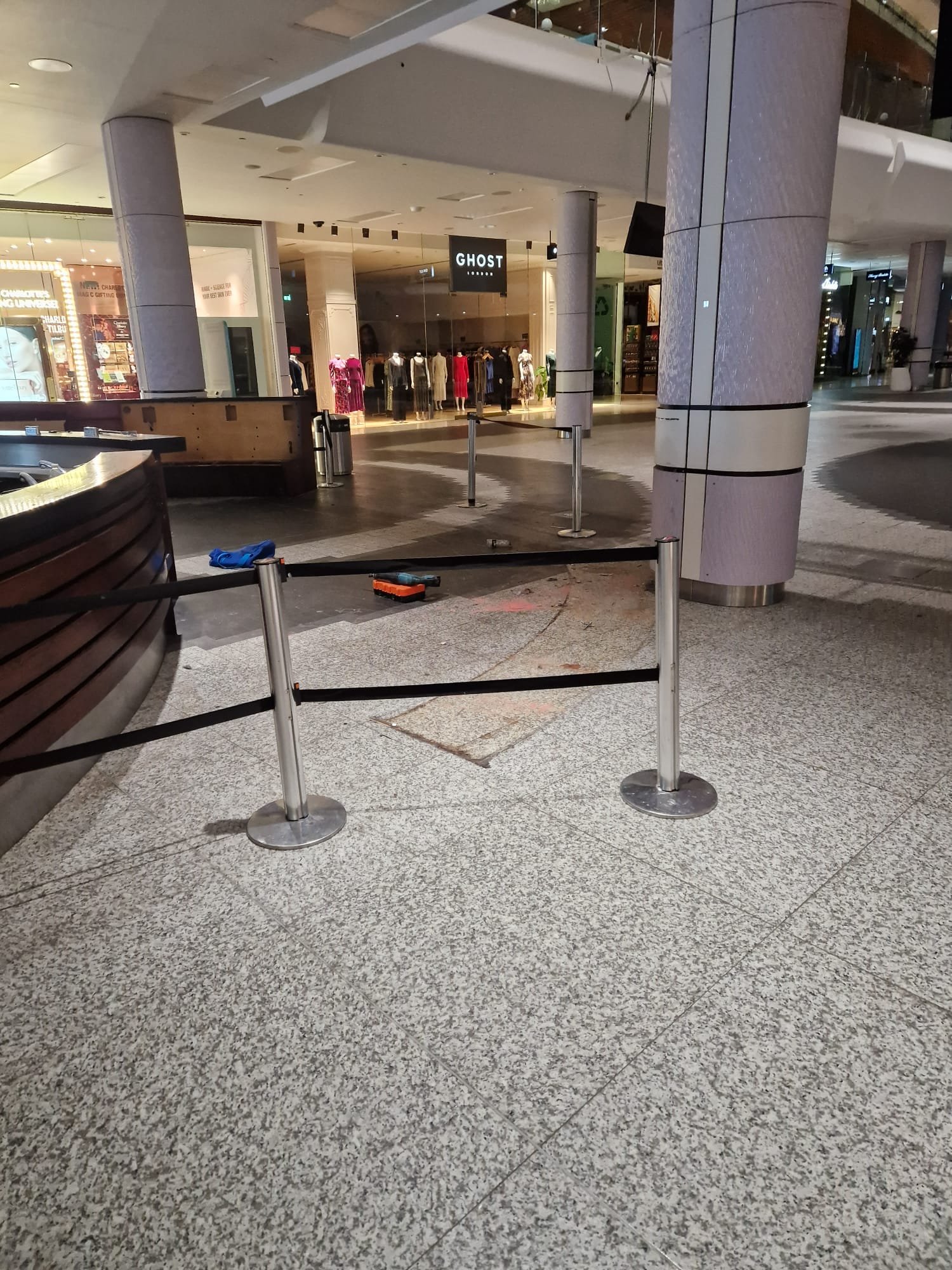 Cleared kiosk footprint with barrier and floor patch