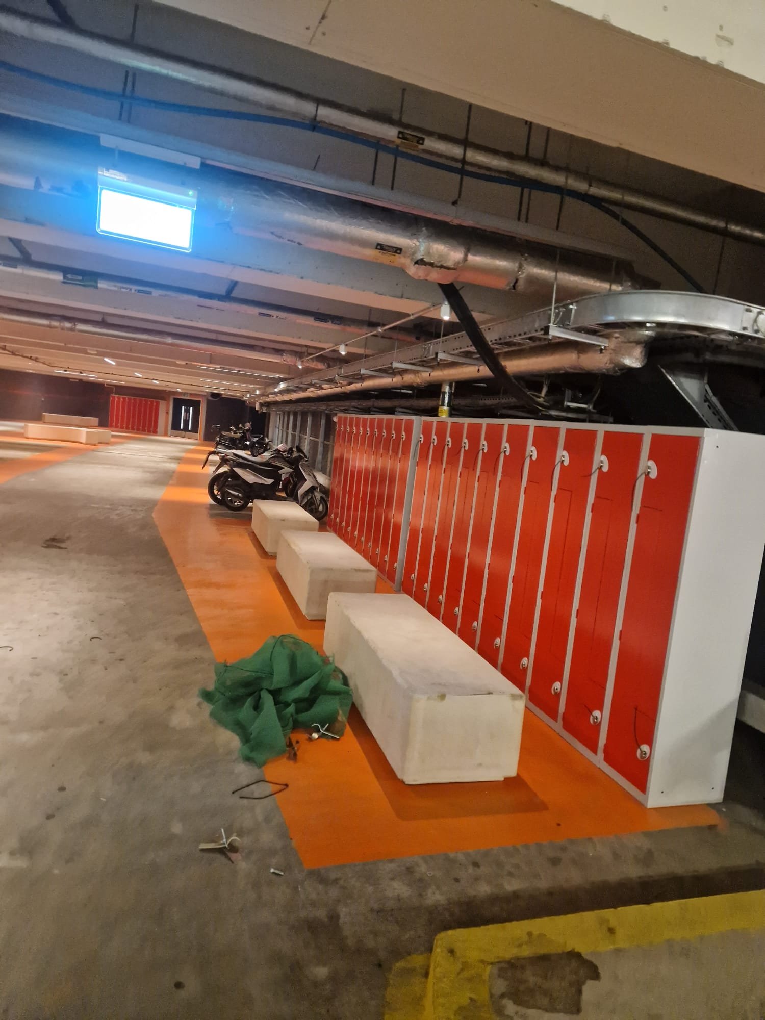 Orange demarcation around lockers and seating area