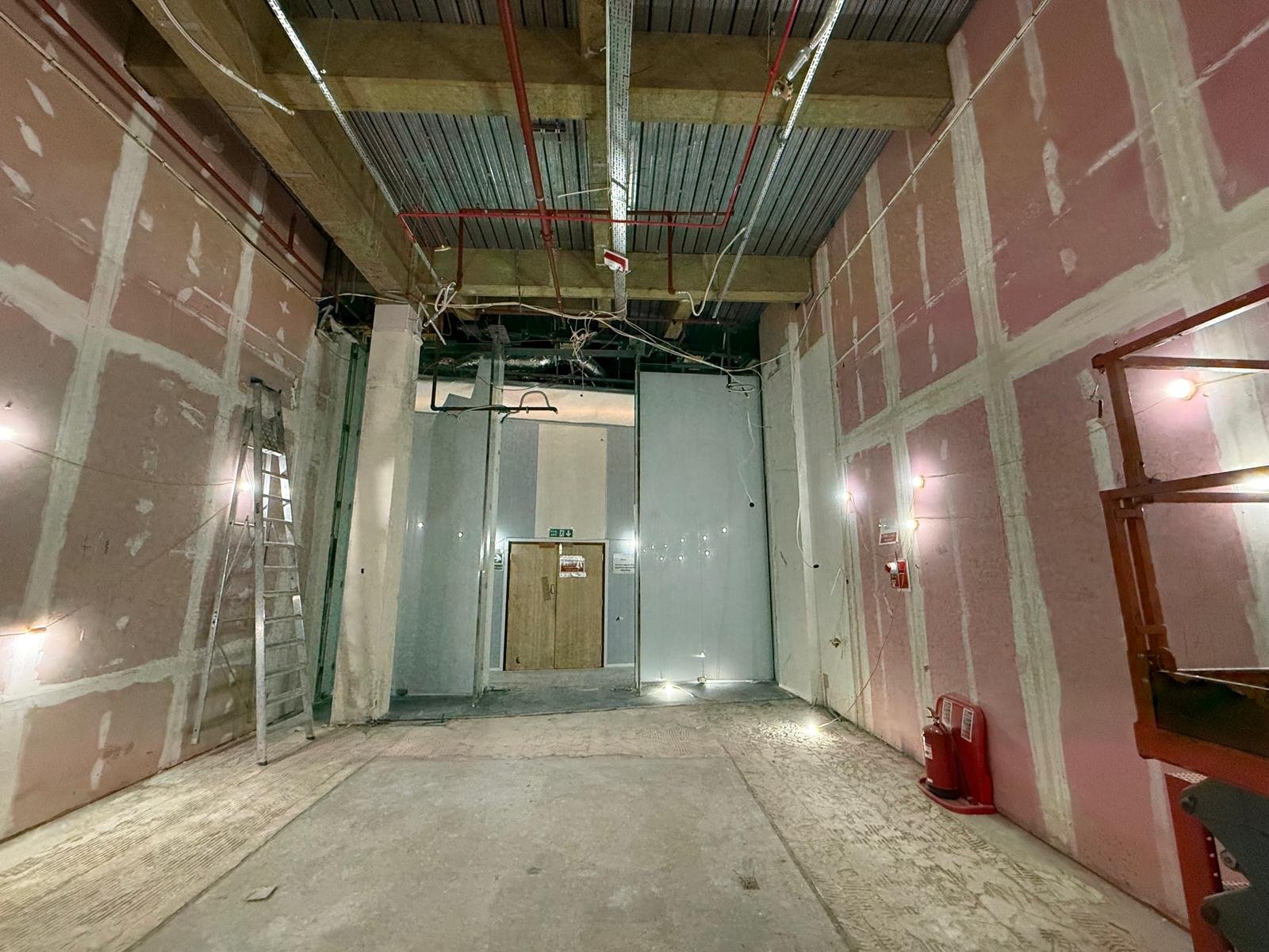 Stripped unit with exposed services and fire-rated boarding