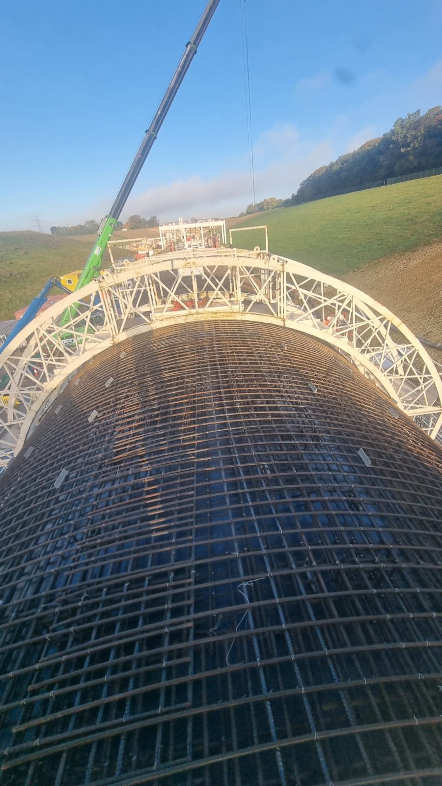 Curved rebar mesh lift over tunnel formwork
