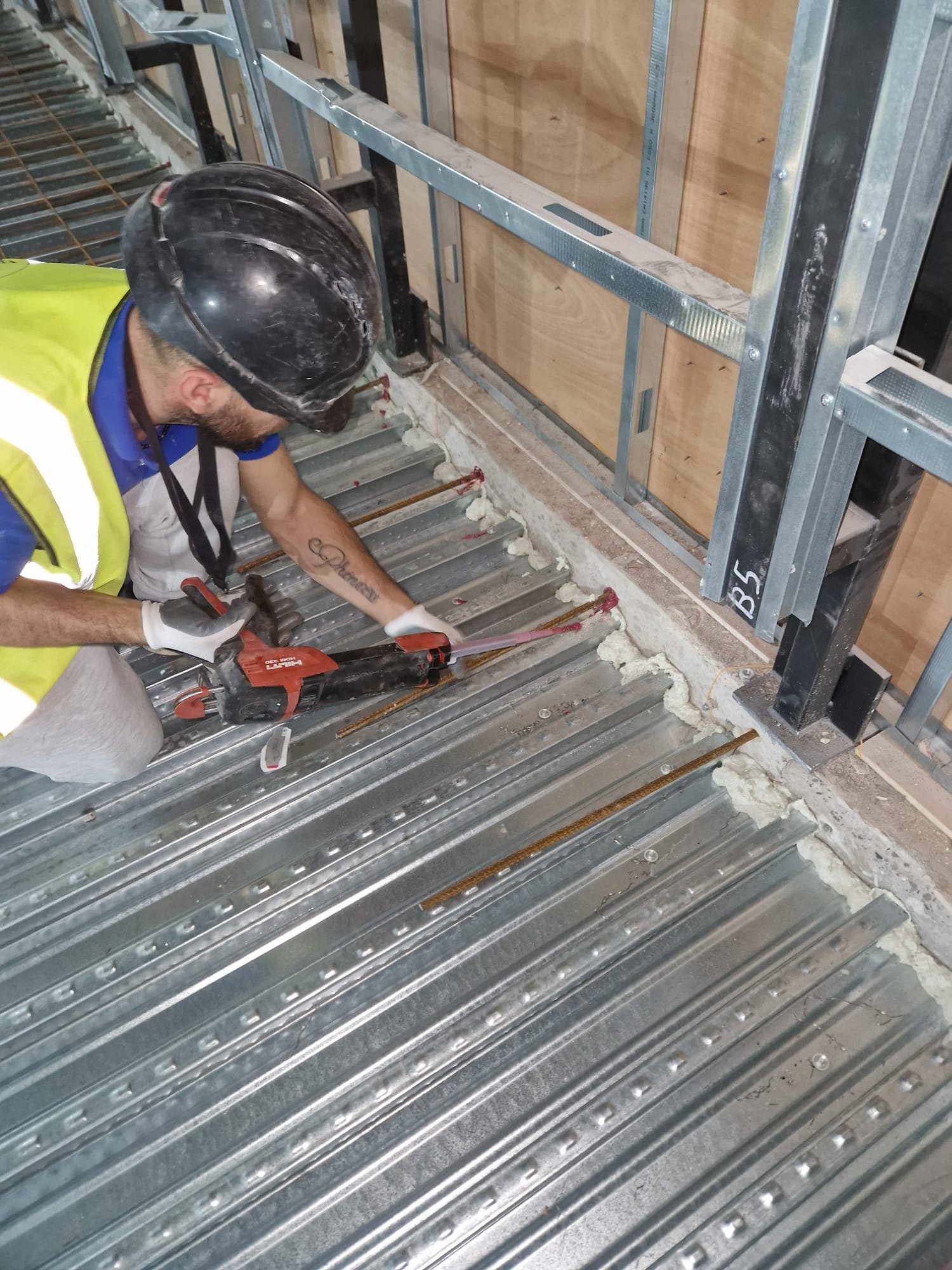 Floor reinforcement and metal decking installation